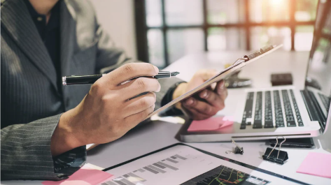 Person with clipboard and pen