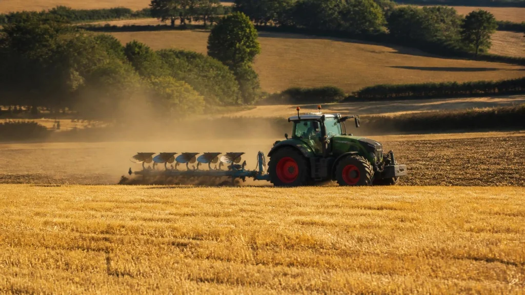 Tractor working a field, one of the few users still allowed red diesel